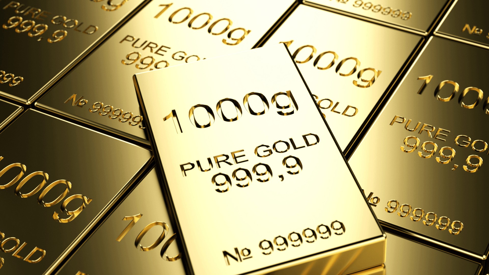 A pile of gold bars sitting on top of each other.